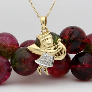Vintage Harp Playing Angel Pendant set with 5 Genuine Natural Round Diamonds in 14-karat yellow Gold and Matching Gold Chain Estate Jewelry!