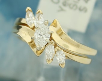 0.55 carat marquise cut diamond engagement ring with matching diamond wedding band made in 14 Karat yellow here in USA!