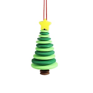 May include: A green and yellow wooden Christmas tree bauble with a star on top. The bauble is strung with red string.