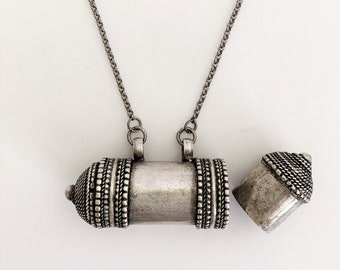 Silver metal secret stash bottle necklace from Nepal on silver/ black stainless-steel chain, Lobster clasp, Holds stones/trinkets/ash/pills