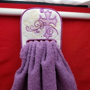 Cross with swirls towel holder embroidery design with Shortie tab.   Quilted and bean stitch - 4" and 5"