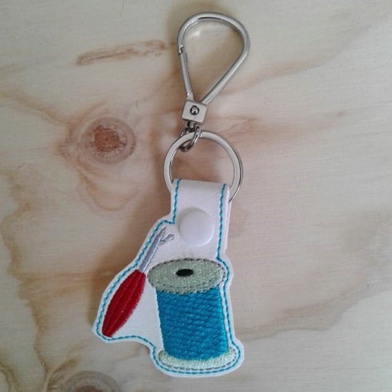 Sewing notions ITH embroidery design.  Seam ripper-thread fob