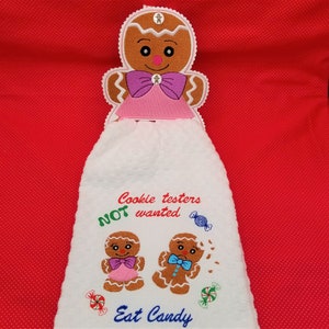 Gingergirl towel holder and shortie tab embroidery designs.  4x4 and 5x7 interchangeable tabs