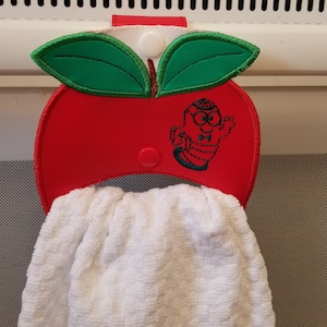 Apple with bookworm towel holder embroidery designs.  4x4 and 5x7 hoops with shortie snap tab