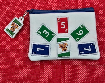 Skip-Bo zip bag with charm embroidery designs.   2 sizes plus charm