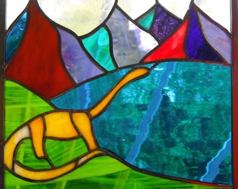 Mountain lake stained glass panel with dinosaur