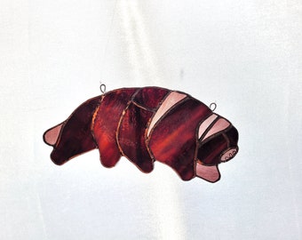 Reddish-purple tardigrade suncatcher