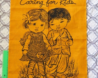 Vintage 1970s / 1980s Caring For Kids linen orange tea towel - World Vision charity - new!