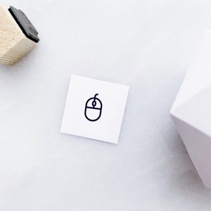 May include: A white square card with a black outline of a computer mouse.