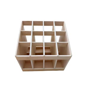 May include: A wooden storage crate with 18 compartments. The crate is made of light-colored wood and has a simple, rectangular design.