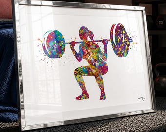 May include: Framed watercolor print of a weightlifter performing a squat. The artwork features a colorful splatter effect, with the figure and barbell rendered in vibrant hues of blue, green, yellow, and purple. The frame is silver.
