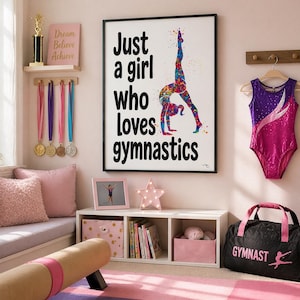 May include: A framed print with the text "Just a girl who loves gymnastics" and a colorful gymnast illustration. A pink and purple leotard hangs on the wall. A black duffel bag with "Gymnast" printed on it sits on the floor.