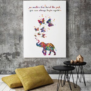 May include: A colorful watercolor painting of an elephant with butterflies flying out of its trunk. The quote "no matter how hard the past, you can always begin again." is written above the elephant.