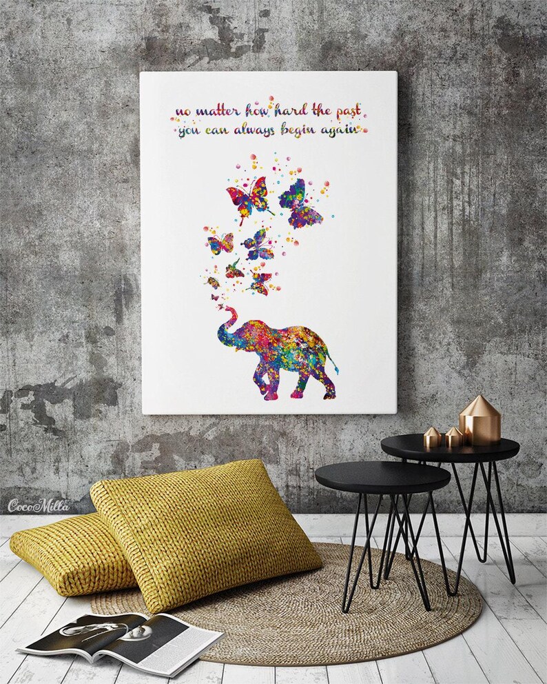 May include: A colorful watercolor painting of an elephant with butterflies flying out of its trunk. The quote "no matter how hard the past, you can always begin again." is written above the elephant.
