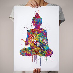 May include: A colorful watercolor print of a seated Buddha figure. The artwork features a vibrant mix of colors, including blue, yellow, red, and green, creating a visually striking and spiritual piece. The image is on a white background.
