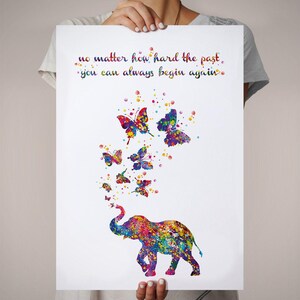 May include: A colorful watercolor painting of an elephant blowing butterflies. The quote "no matter how hard the past, you can always begin again." is written above the elephant.