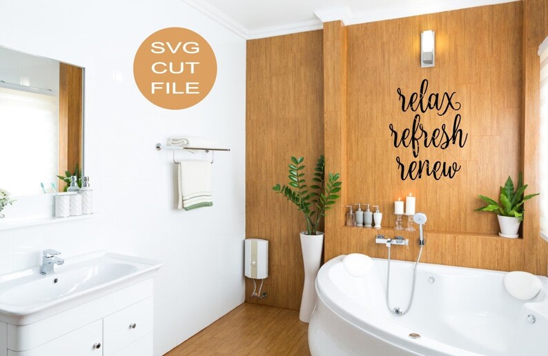 May include: A bathroom with a white bathtub, a white sink, and a wooden wall with the text "relax refresh renew" in black cursive writing.