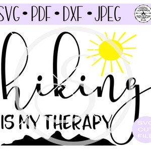 May include: Black and white graphic design with the text "hiking is my therapy" and a yellow sun with rays. The design also includes a black silhouette of mountains.
