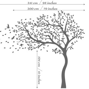 May include: A black silhouette of a large tree with leaves blowing in the wind. The tree is 84 inches tall and 79 inches wide. The tree is shown with measurements in inches and centimeters.