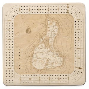 May include: A square light-colored wooden cribbage board featuring an engraved nautical map of Block Island in the center. The board includes a perimeter track with numbered holes for scoring, a compass rose, and the text WOOD CHART.