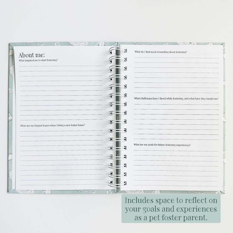 May include: An open spiral-bound journal with light blue covers featuring a white floral pattern. The pages contain printed prompts including About me, What inspired me to start fostering, and questions about rewarding experiences and goals.