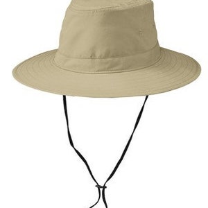 May include: A beige sun hat with a wide brim and a black chin strap.