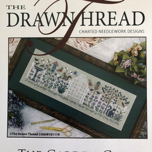 May include: A framed cross-stitch pattern titled "The Garden Gate" by The Drawn Thread. The design features a garden scene with a white gate, flowers, birds, and the text "Those who enter through this gate come never too early nor stay too late."