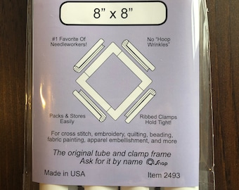 May include: A Q-Snap needlework frame, 8" x 8", in a clear plastic package. The frame is white and designed for cross stitch, embroidery, and other crafts. Text on the package includes "#1 Favorite Of Needleworkers!" and "No Hoop Wrinkles."