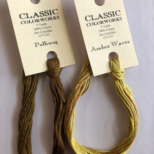 May include: Two skeins of embroidery floss, one green and one yellow, with labels that read "Classic Colorworks" and include the color names "Polliwog" and "Amber Waves".