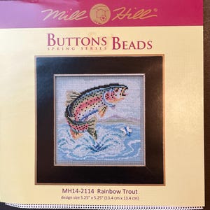 May include: A cross-stitch pattern featuring a rainbow trout jumping out of the water. The pattern is called "Rainbow Trout" and is part of the "Buttons Beads Spring Series". The design size is 5.25 inches by 5.25 inches (13.4 cm by 13.4 cm).