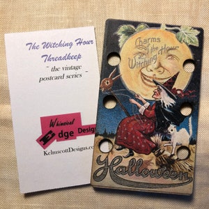 May include: A vintage Halloween themed wooden thread spool with a witch flying on a broomstick in front of a smiling moon. The text "Charms of the Witching Hour" and "Halloween" are visible on the spool.