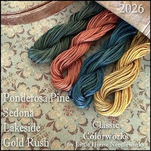 May include: Close-up of four skeins of embroidery floss in shades of green, orange, teal, and gold. The floss is arranged on a floral patterned fabric. The colors are labeled: Ponderosa Pine, Sedona, Lakeside, and Gold Rush. The number 2026 is visible.