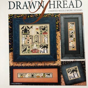 May include: A page from "The Drawn Thread" featuring charted needlework designs with a Halloween theme. The page includes framed cross-stitch samplers with spooky motifs like bats, ghosts, and pumpkins. The text "LITTLE BITS OF HALLOWEEN" is at the bottom.
