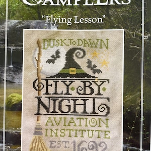 May include: A cross-stitch pattern featuring a witch flying on a broomstick with the text "Dusk to Dawn Fly By Night Aviation Institute Est 1692".