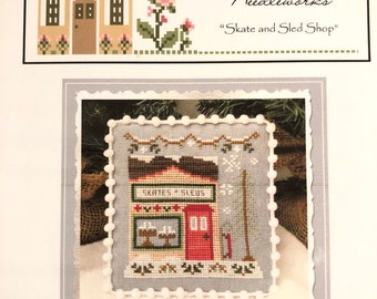 Skate and Sled Shop / SNOW VILLAGE / Country Cottage Needleworks Series / cross stitch chart / pattern only