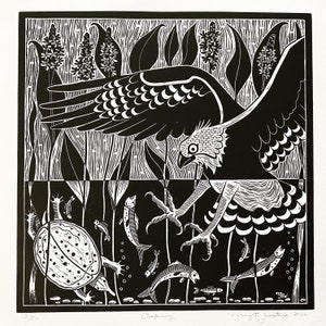 May include: A black and white woodblock print of a hawk with its talons extended, catching a turtle in a pond. The hawk is flying above the water, and the turtle is in the water with fish swimming around it. The print is signed "Meg T. Justice 2022" and numbered "13/50".