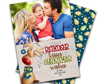 May include: A Christmas card featuring a family of three with a cartoon reindeer and the text "Sending Reindeer Kisses and Christmas Wishes".