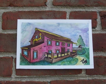 May include: A watercolor painting of a pink house with a yellow roof and a porch. The house has windows and a door. The painting is on a white background.