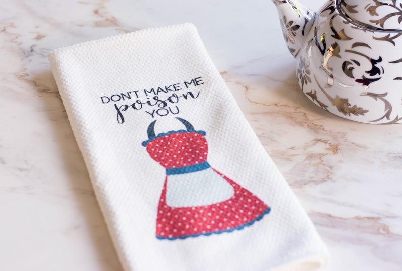 May include: White kitchen towel with red and blue polka dot apron design and the text "Don't make me poison you".