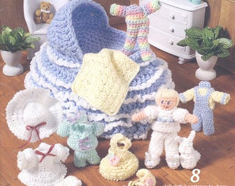 May include: A selection of crocheted baby items in pastel shades. The image shows a blue and white bassinet, clothing, and accessories. A doll and a small white bunny are also present. The text reads "8 delightful patterns to dress up a playtime companion using baby yarn."