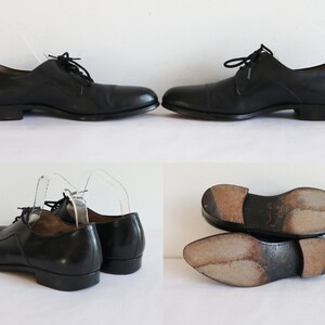 May include: Black leather dress shoes with laces. The shoes have a classic design with a low heel. The image shows the shoes from multiple angles, including the soles.