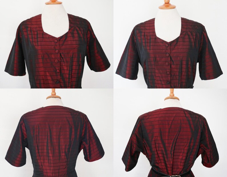May include: A vintage red and black dress with short sleeves and a square neckline. The dress features a button-down front and a fitted waist. The fabric has a subtle striped pattern. The dress is displayed on a mannequin.