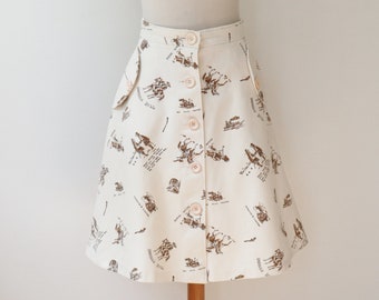 Ivory 70s Novelty Print Through Buttoned A-Line Skirt // Brown Cowboy/Indian Pattern // 100% Cotton // Size M