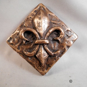 Bronzen Fleur d' Lis decoratieve stiptegel