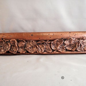 Rieles de silla con hojas de cobre envejecido