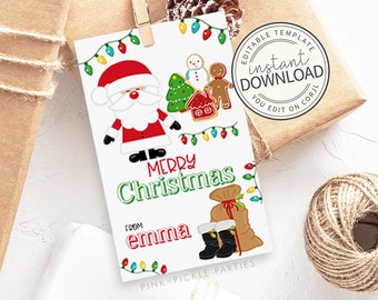 May include: A white Christmas gift tag with a Santa Claus illustration, Christmas tree, gingerbread man, and the words "Merry Christmas" and "from Emma". The tag is decorated with colorful lights and a gift bag.