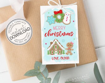 May include: A gift tag with a light blue background and the words "MERRY CHRISTMAS" in red. The tag features gingerbread house and cookie designs. The tag is tied to a wrapped gift with white twine.
