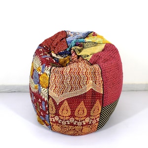 May include: A colorful patchwork bean bag chair with a variety of floral and geometric patterns in shades of red, yellow, blue, and green.