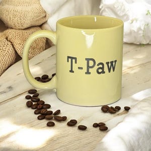 Custom ceramic mug engraved free. Beige custom engraved coffee mug holds 12 oz of hot or cold liquid.