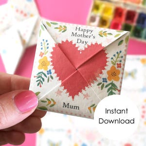 May include: A folded paper fortune teller with a red heart design and floral accents. The text "Happy Mother's Day" and "Mum" are visible. The words "Instant Download" are also present.